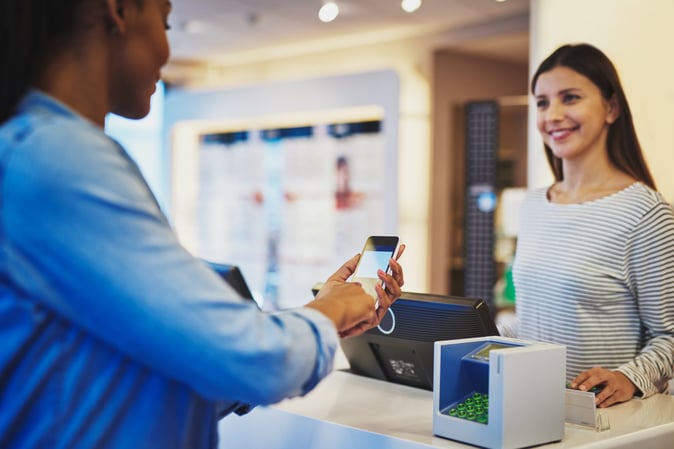 retail store - lady paying at counter