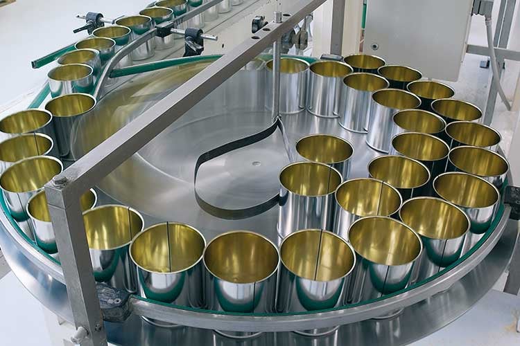 A conveyor belt of cans in a factory. 